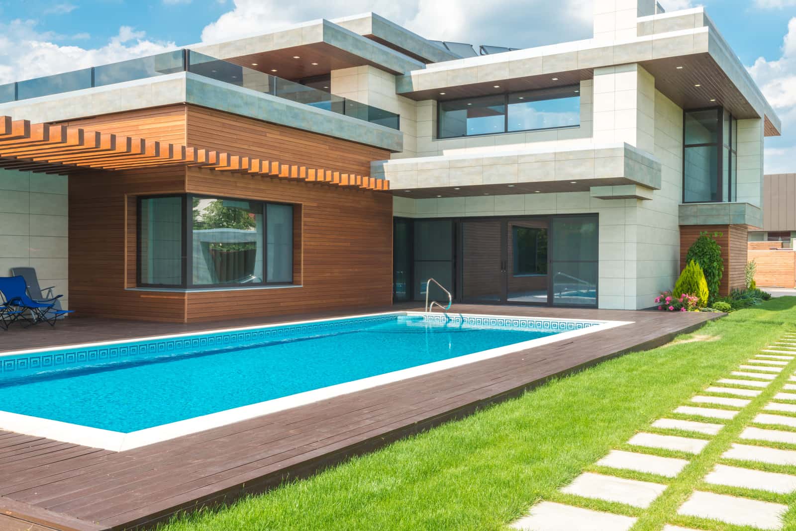 A modern inground swimming pool with clear blue water