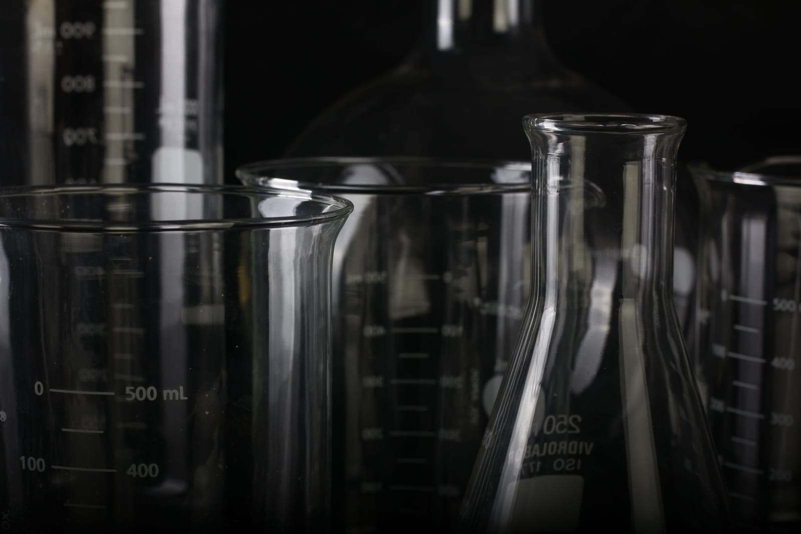 Testing pool water chemistry in a laboratory beaker