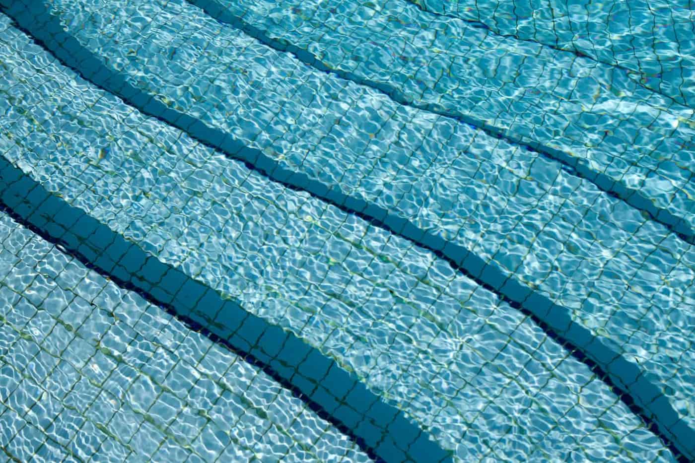 Sunlight through clear swimming pool water