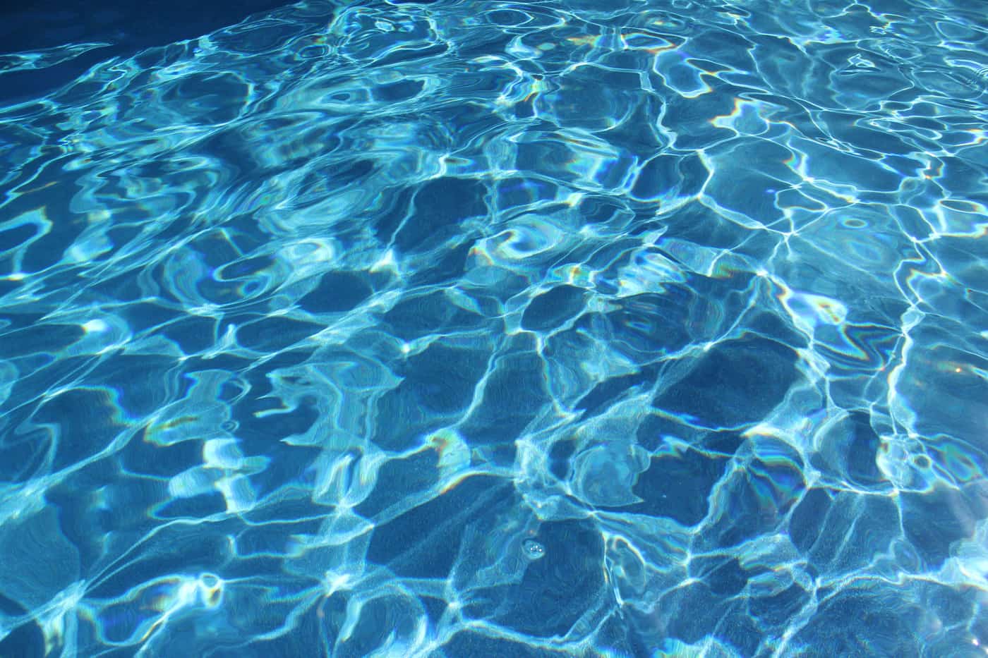 Bright sunlight on a swimming pool surface after a heavy shock treatment