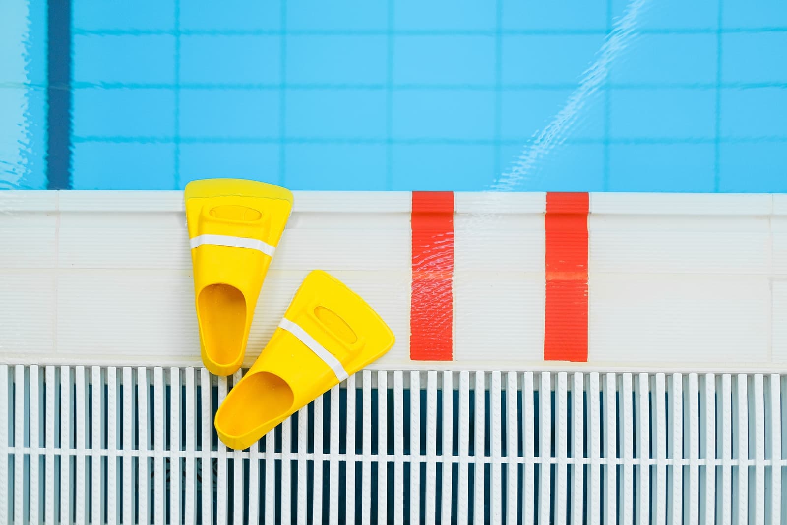 Pool equipment and cleaning machinery at a poolside