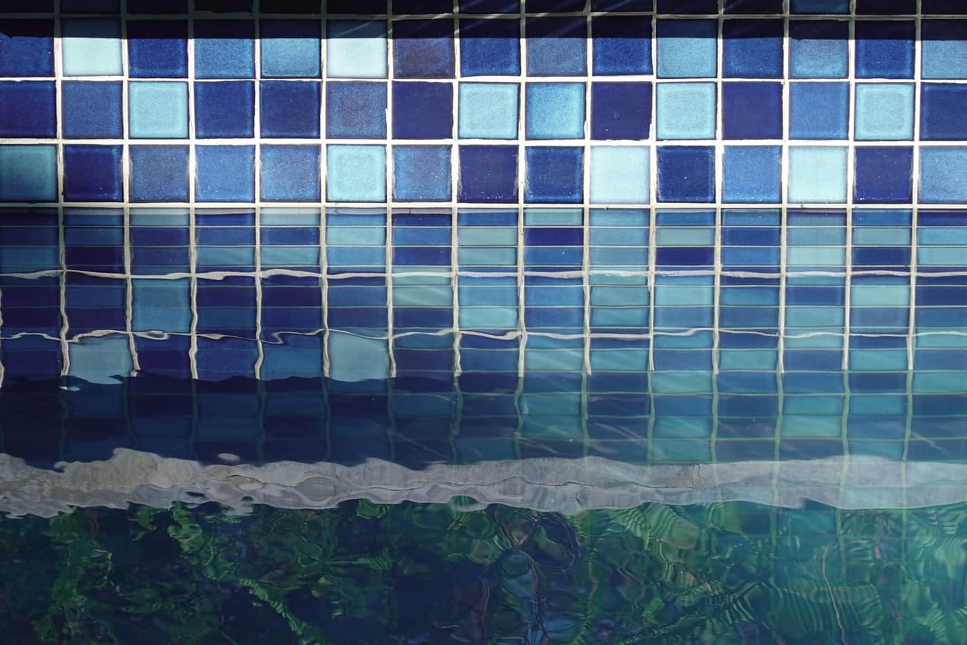The clean waterline and tile of a well-maintained swimming pool